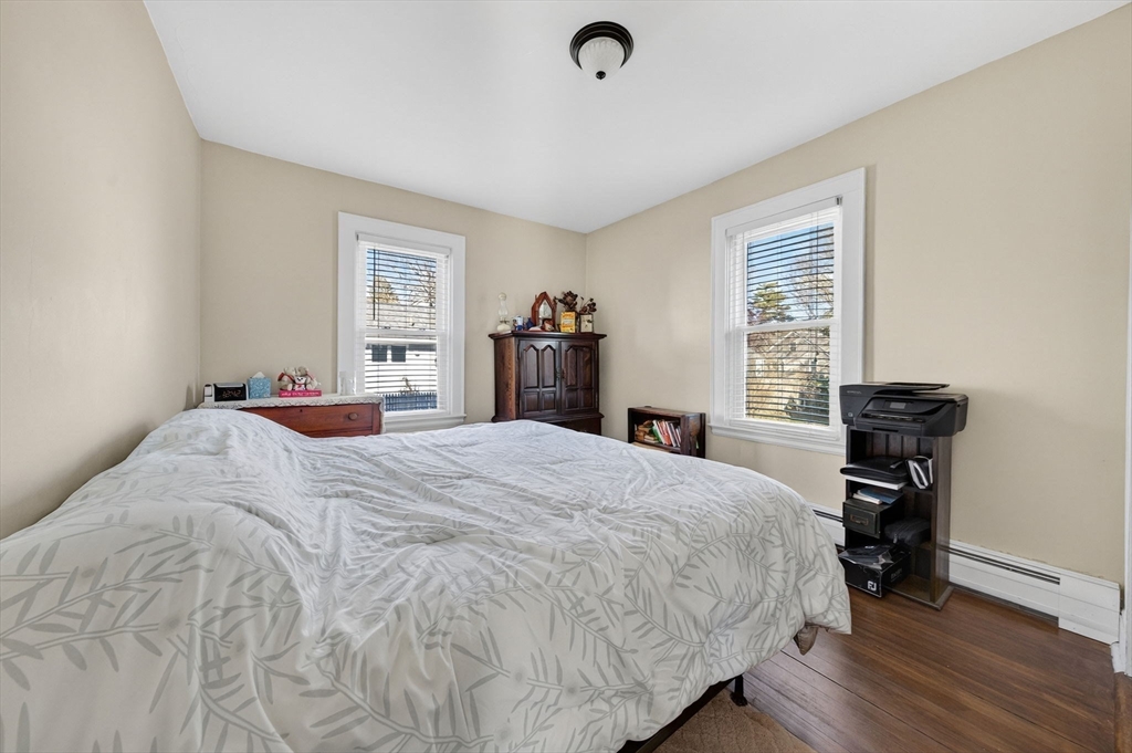18 Maple Street Fairhaven, MA 02719 - Photo 19 of 39 a bedroom with a bed and a desk