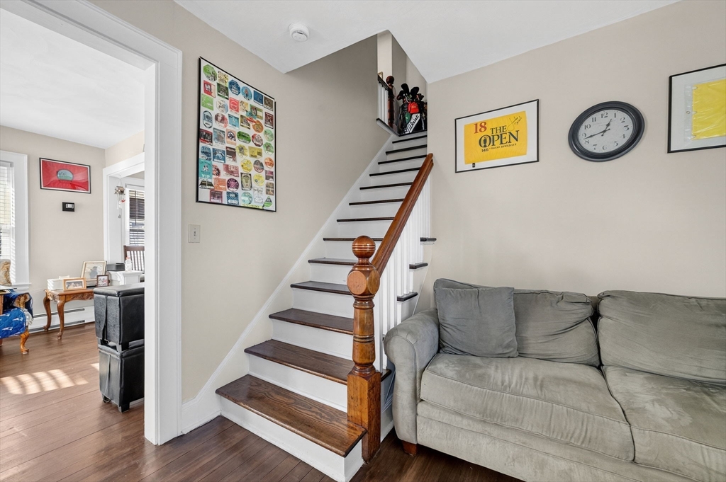 18 Maple Street Fairhaven, MA 02719 - Photo 24 of 39 a living room with furniture and a wall painting