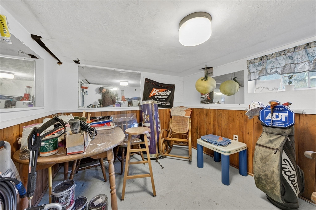 18 Maple Street Fairhaven, MA 02719 - Photo 30 of 39 a view of a dining room with furniture and chandelier