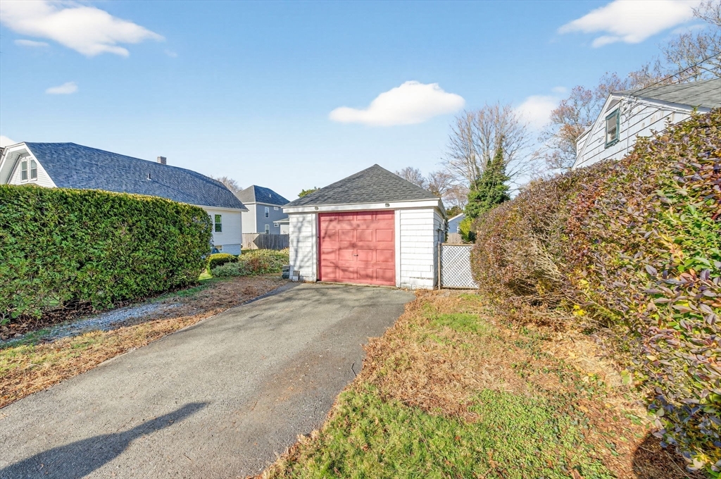 18 Maple Street Fairhaven, MA 02719 - Photo 35 of 39 a front view of a house with a yard and garage