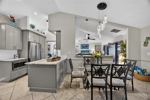 a kitchen with a sink cabinets and appliances