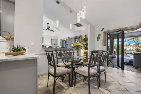 a bed room with a bed and a chandelier