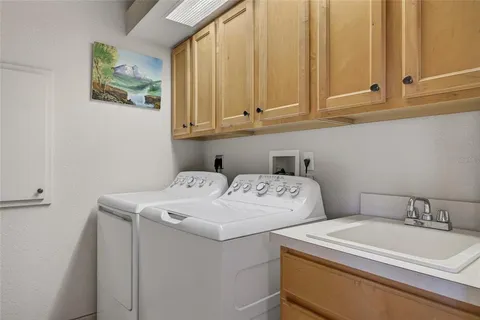 a view of a dining room with furniture large windows and wooden floor