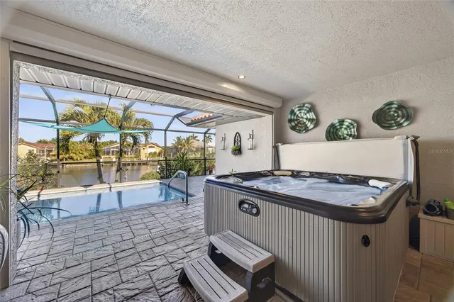 a view of a porch with dining table and chairs