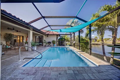a view of a swimming pool with a patio