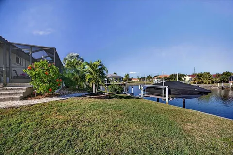 a view of swimming pool with outdoor seating and lake view
