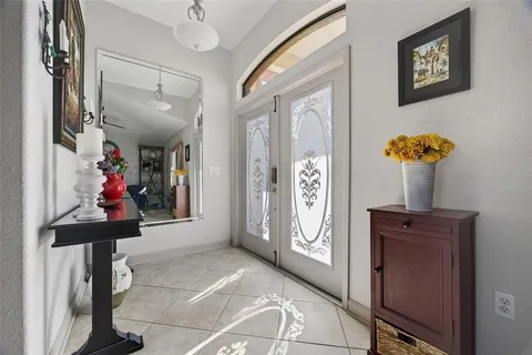 a view of a livingroom with furniture and windows