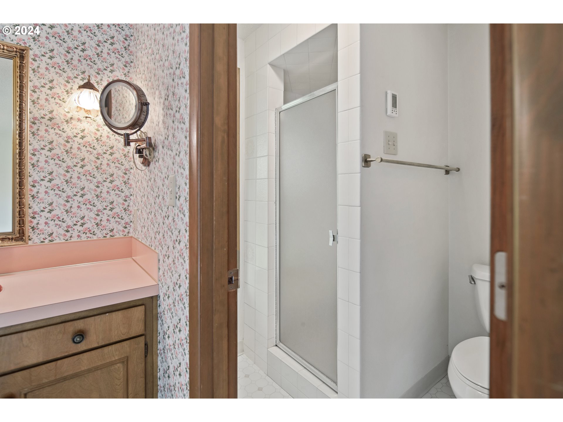 1065 Chestnut Street Northwest Salem, OR 97304 - Photo 26 of 44 a bathroom with a granite countertop sink a mirror and shower