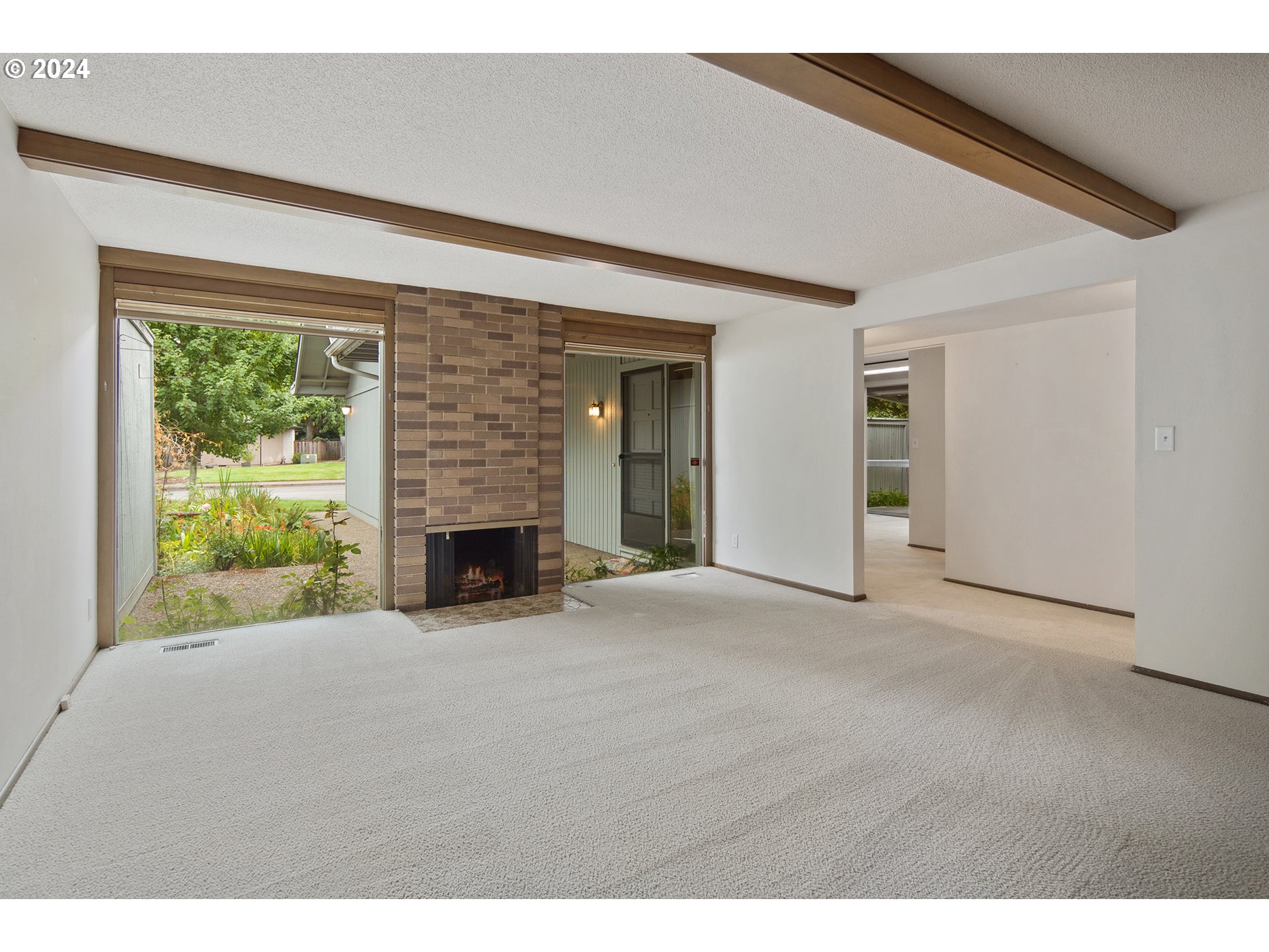 1065 Chestnut Street Northwest Salem, OR 97304 - Photo 4 of 44 a view of a livingroom with a fireplace a ceiling fan and front door