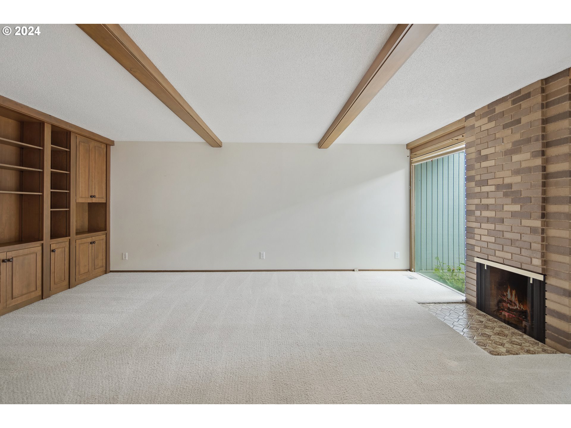 1065 Chestnut Street Northwest Salem, OR 97304 - Photo 5 of 44 a view of an empty room with a fireplace