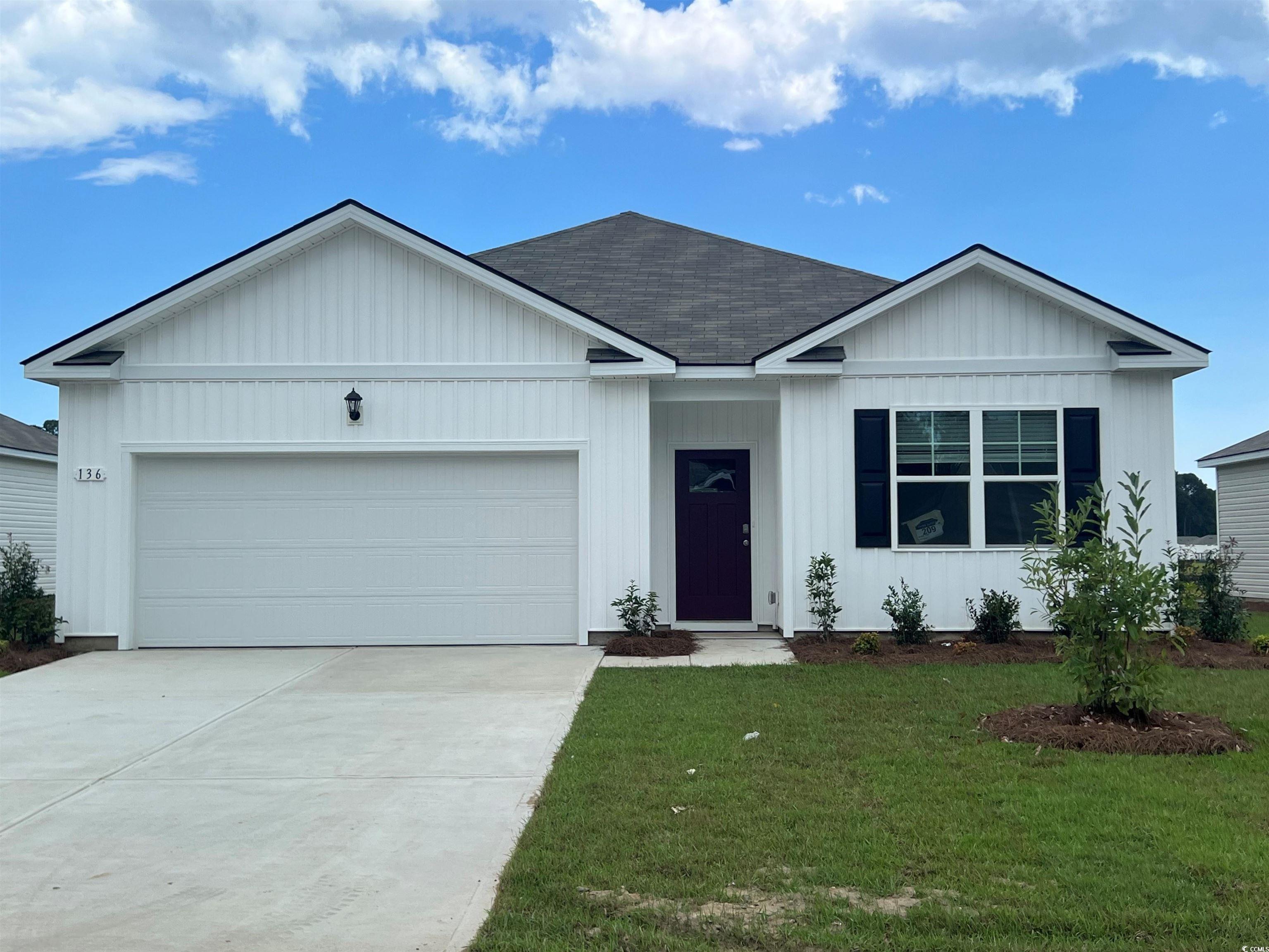 Single story home featuring an attached garage, a