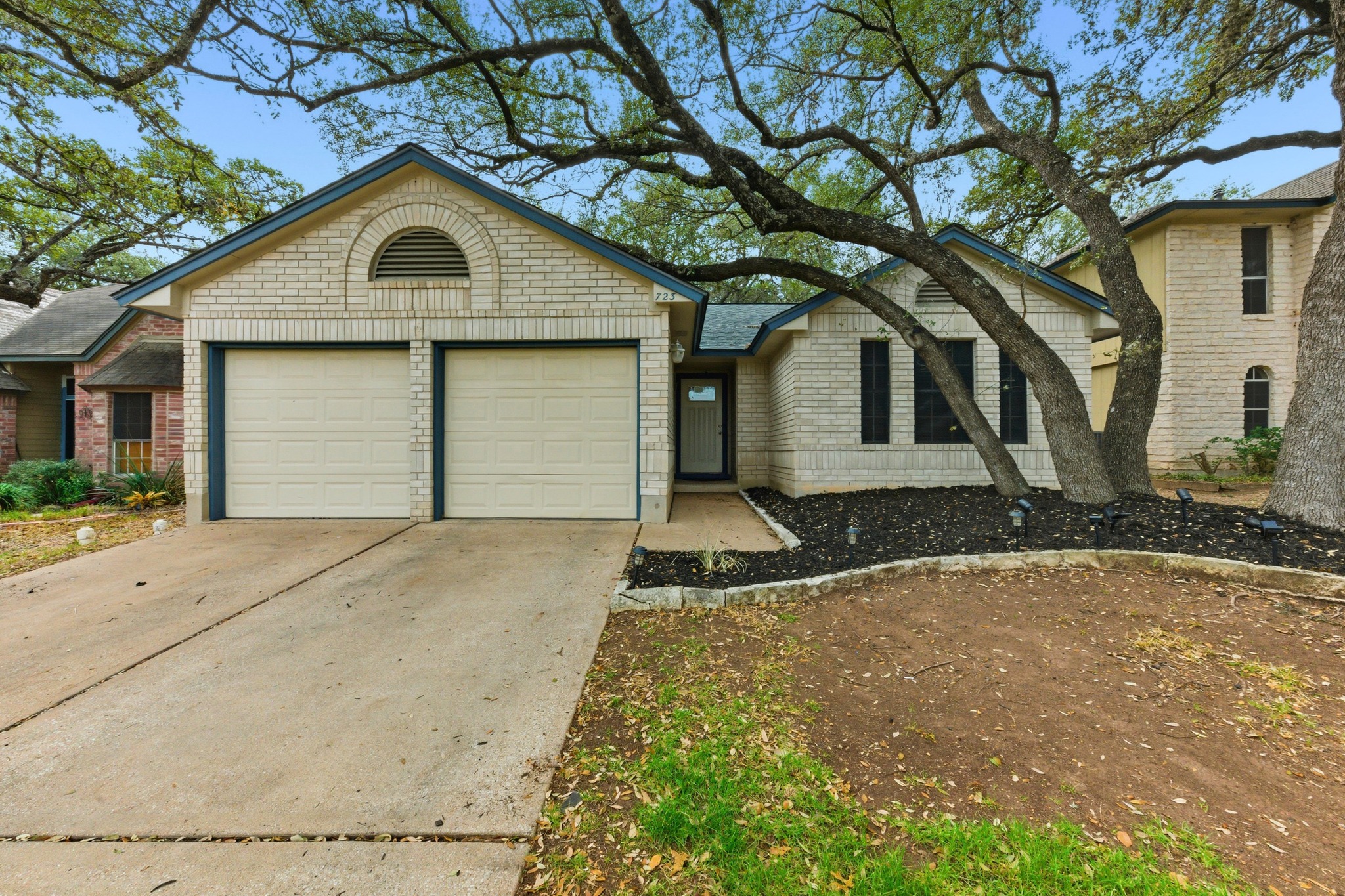 723 Shade Tree Drive Austin, TX 78748 - Photo 1 of 1 Ranch-style home featuring driveway and an attached garage