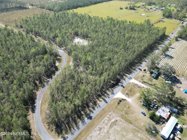 a view of a lake with a yard