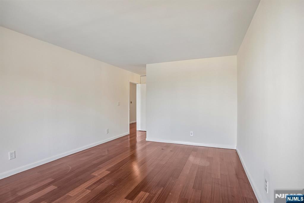 1077 River Road, Unit 1013 Edgewater, NJ 07020 - Photo 14 of 24 a view of an empty room with wooden floor