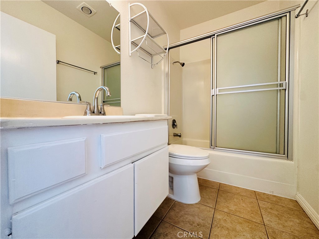 4146 Elm Avenue, Unit 5 Long Beach, CA 90807 - Photo 11 of 24 a bathroom with a sink toilet and shower