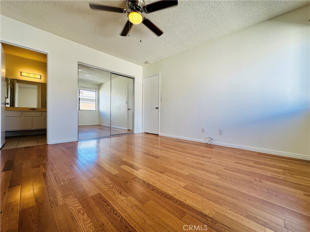 4146 Elm Avenue, Unit 5 Long Beach, CA 90807 - Photo 14 of 24 a view of an empty room and wooden floor