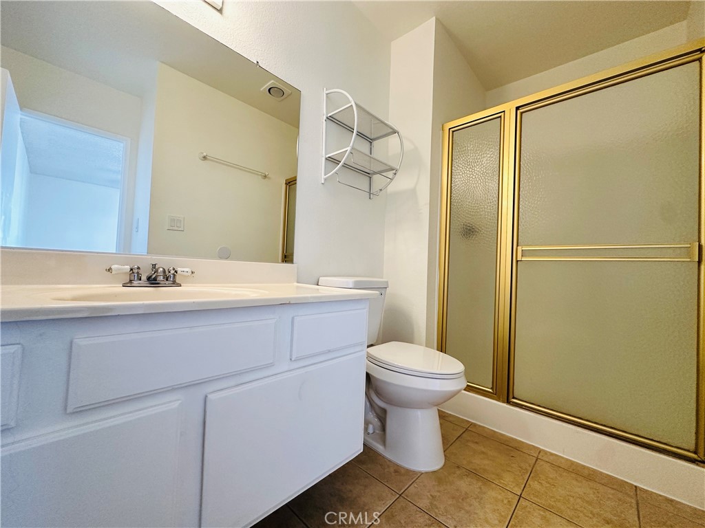4146 Elm Avenue, Unit 5 Long Beach, CA 90807 - Photo 16 of 24 a bathroom with a sink toilet and shower