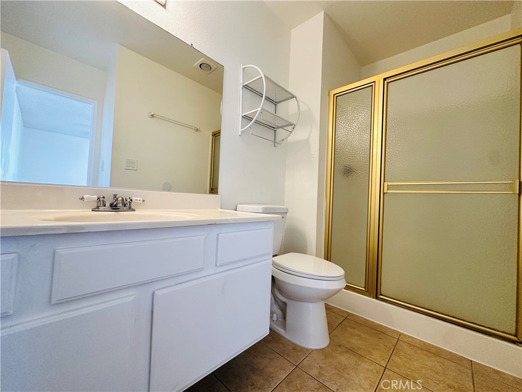4146 Elm Avenue, Unit 5 Long Beach, CA 90807 - Photo 17 of 24 a bathroom with a sink toilet and shower