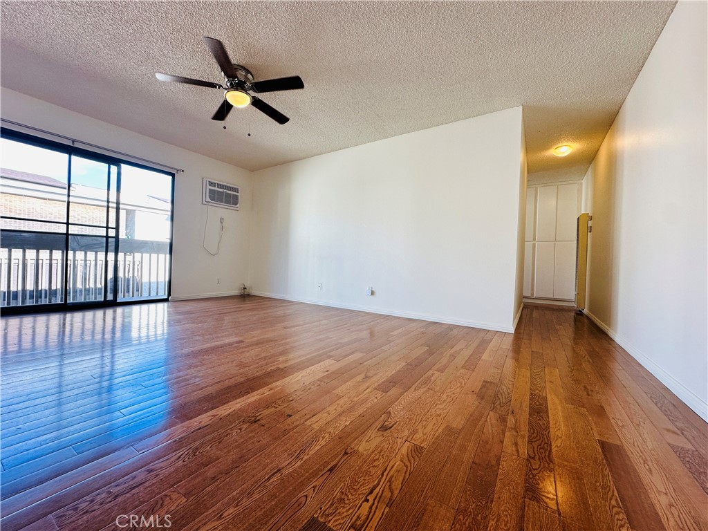 4146 Elm Avenue, Unit 5 Long Beach, CA 90807 - Photo 2 of 24 wooden floor in an empty room with a window