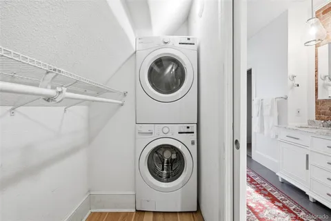 a view of a hallway with washer and dryer