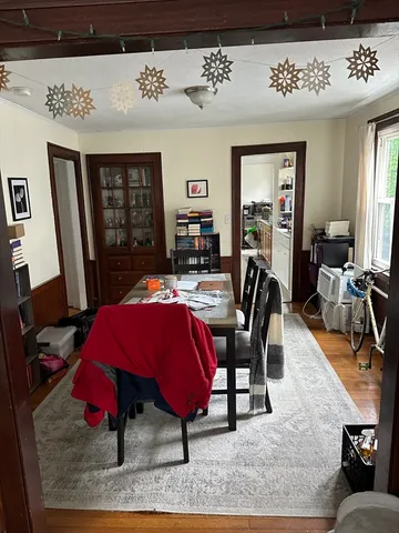 a living room with furniture a rug and a flat screen tv