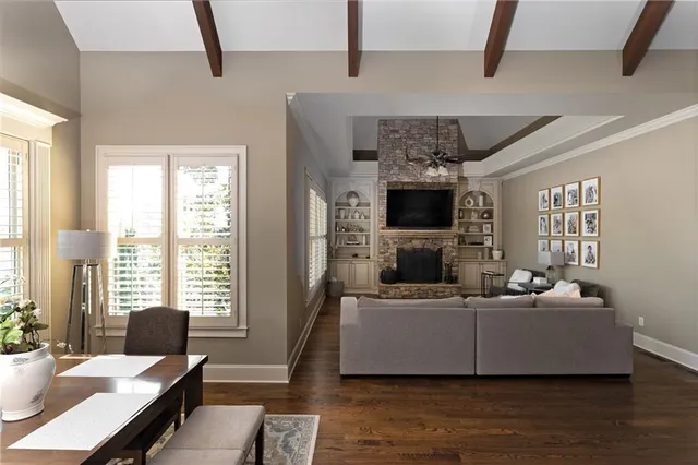 a living room with furniture and flowers