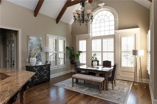 a living room with fireplace furniture and a flat screen tv