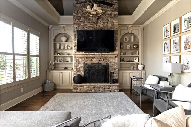 a kitchen with granite countertop a sink and cabinets