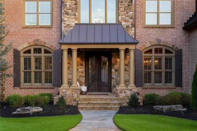 a front view of a house with garden