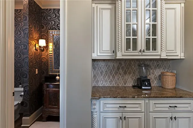 a view of a room with windows and wooden floor