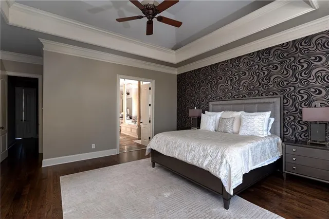 a bathroom with a double vanity sink a mirror and a bathtub