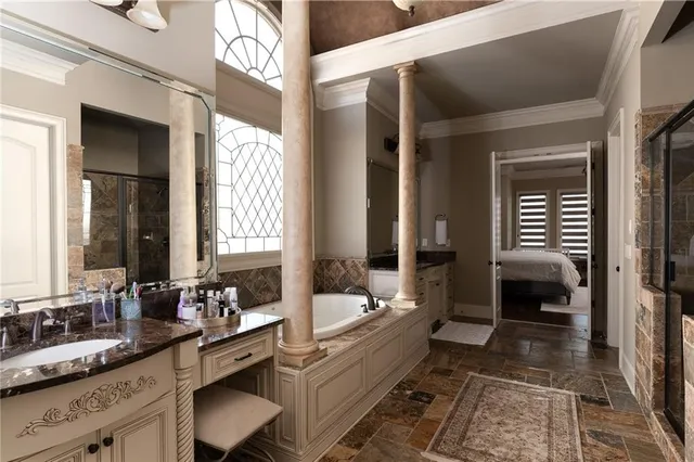 a kitchen with a sink a stove and cabinets