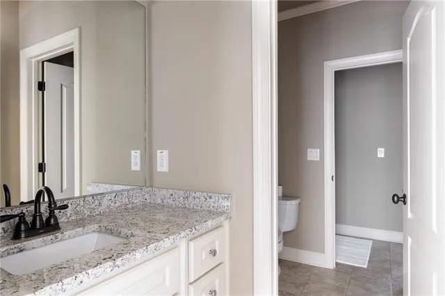 a bedroom with a bed and a chair