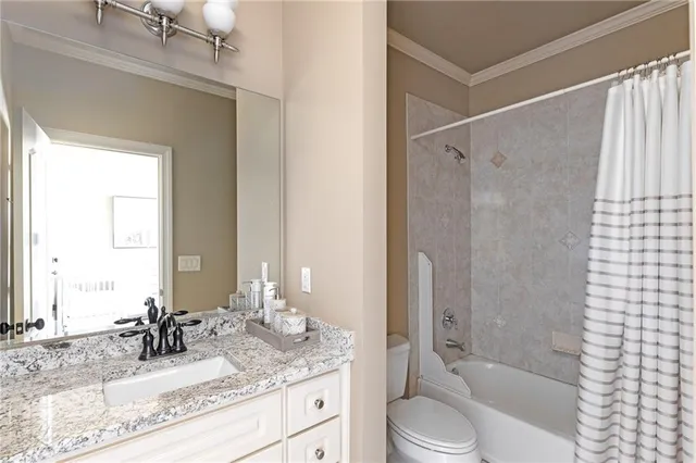 a view of a room with wooden floor and furniture