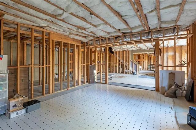 a balcony with furniture and a large window