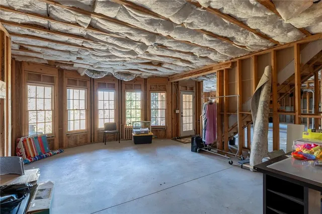 a view of a brick house with large windows