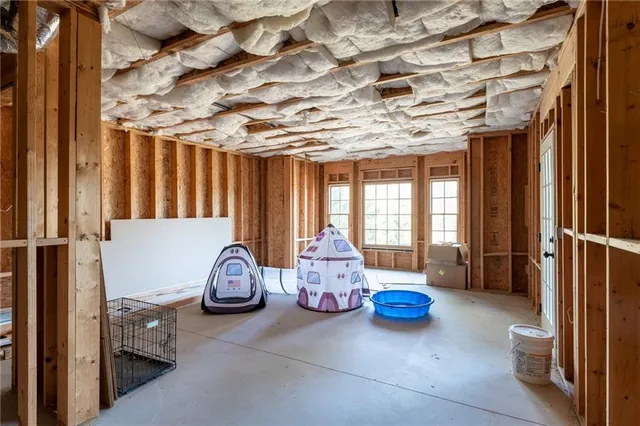 a front view of a building with trees