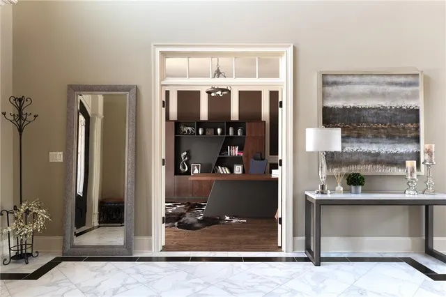 a kitchen with a refrigerator and a stove