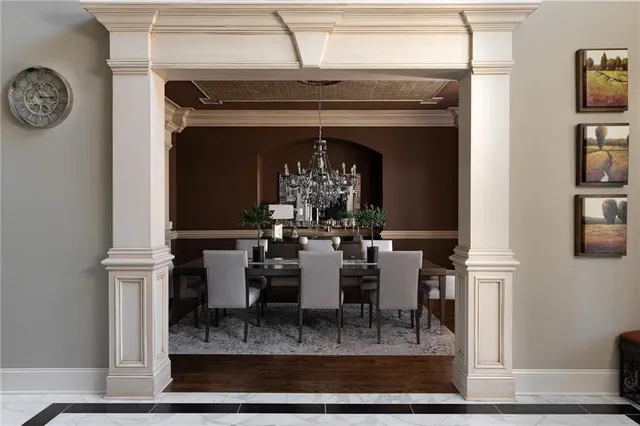 a dining room with furniture and entryway