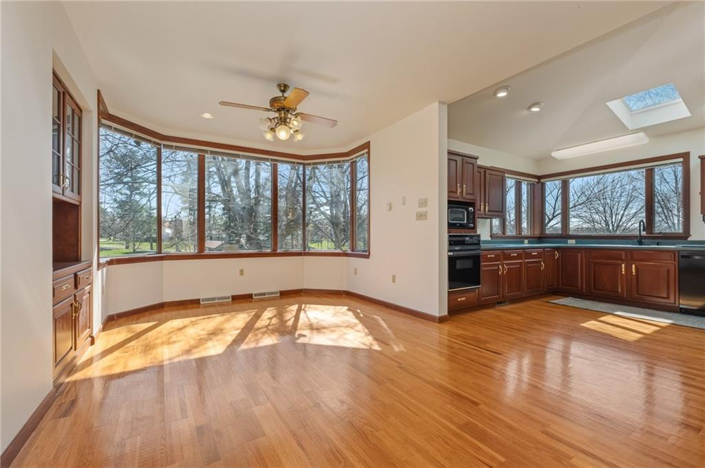 739 Butler Road Kittanning, PA 16201 - Photo 11 of 50 a view of an empty room with a kitchen and wooden floor
