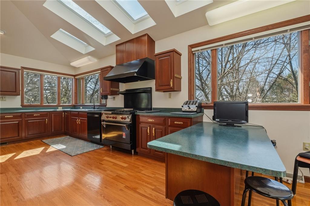 739 Butler Road Kittanning, PA 16201 - Photo 20 of 50 a kitchen with a stove a refrigerator and a dining table