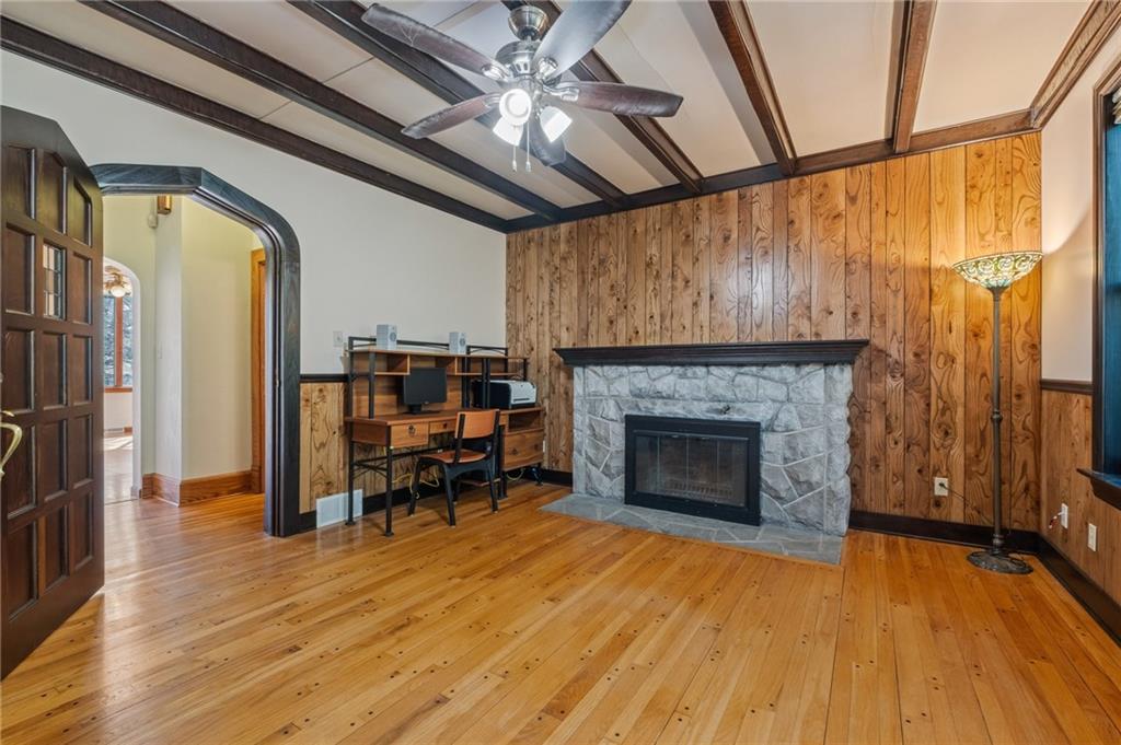 739 Butler Road Kittanning, PA 16201 - Photo 24 of 50 a living room with wooden floors and a fireplace