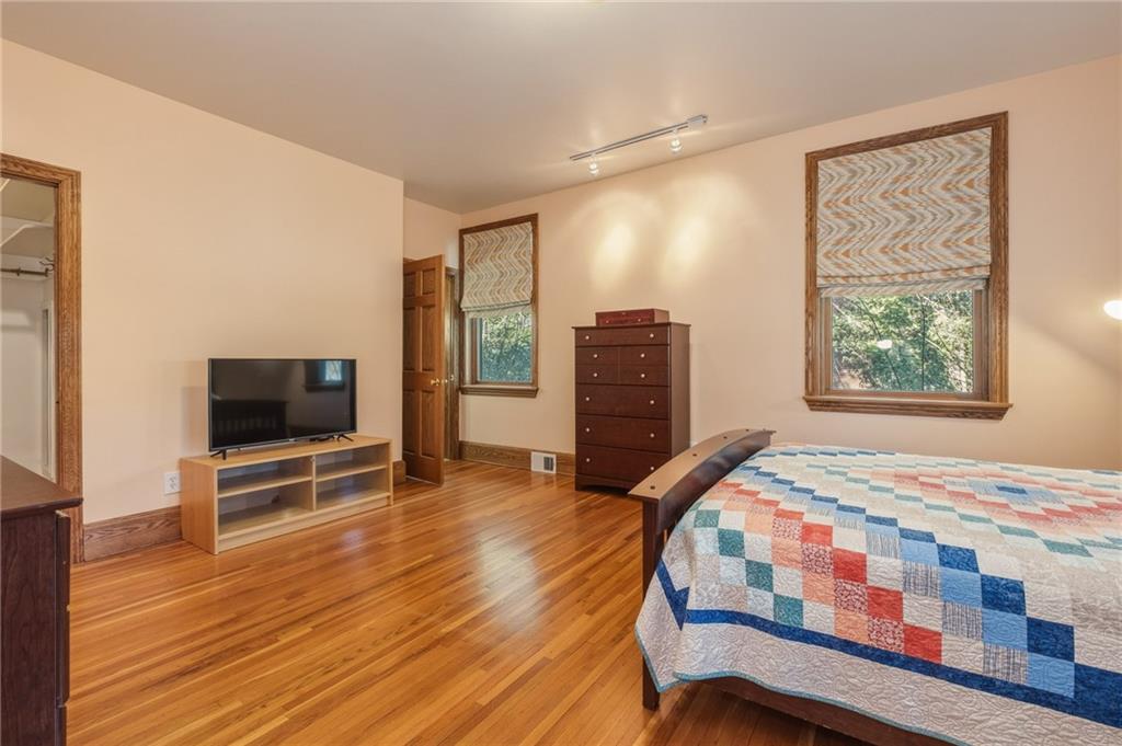 739 Butler Road Kittanning, PA 16201 - Photo 26 of 50 a bedroom with a bed and a flat screen tv