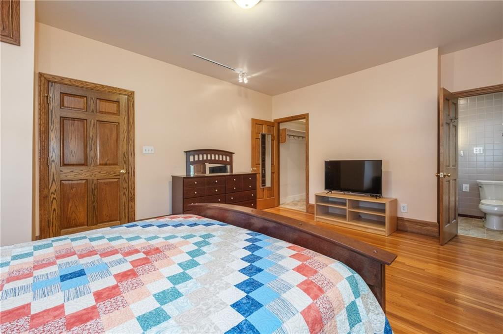 739 Butler Road Kittanning, PA 16201 - Photo 27 of 50 a bedroom with a bed and a flat screen tv