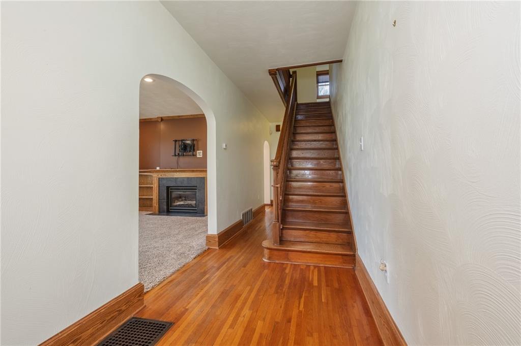 739 Butler Road Kittanning, PA 16201 - Photo 30 of 50 a view of a hallway with wooden floor and stairs
