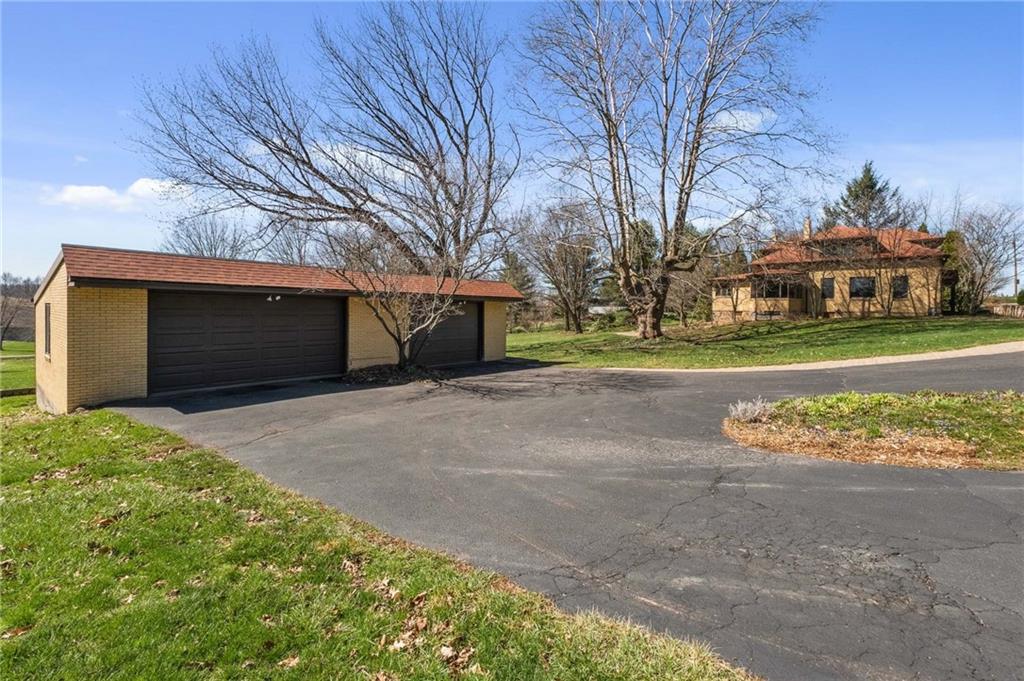 739 Butler Road Kittanning, PA 16201 - Photo 3 of 50 a front view of a house with a yard and garage