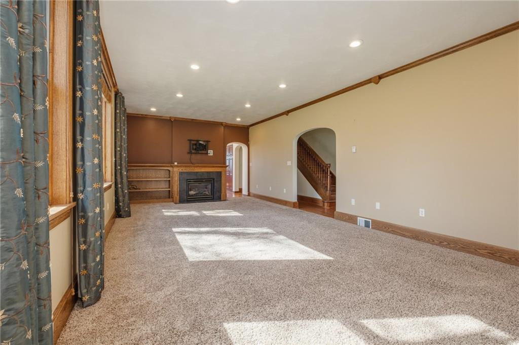 739 Butler Road Kittanning, PA 16201 - Photo 8 of 50 a view of a livingroom with furniture a fireplace and window