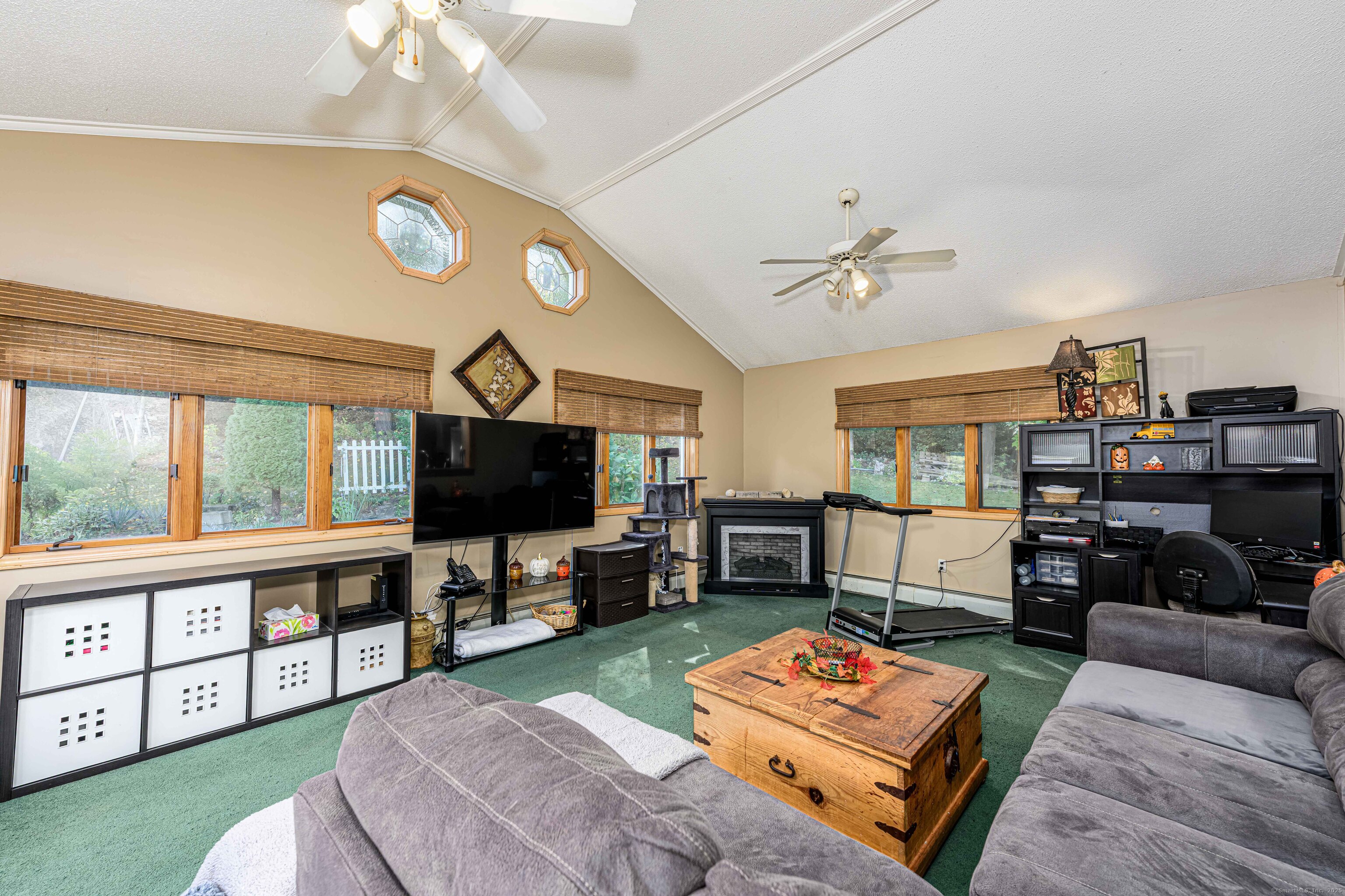 201 Rimmon Road North Haven, CT 06473 - Photo 11 of 40 a living room with furniture a rug and a flat screen tv