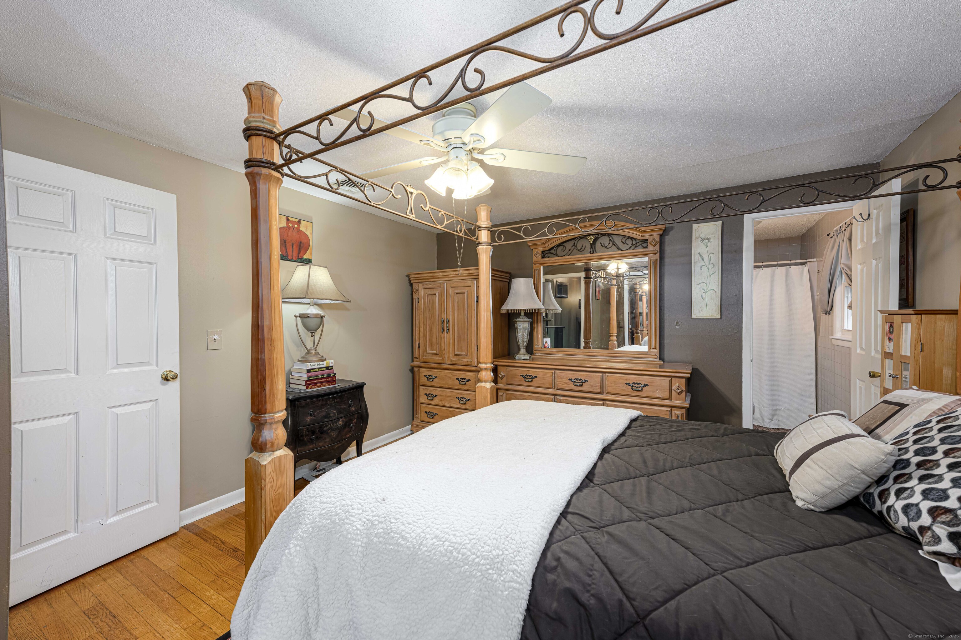 201 Rimmon Road North Haven, CT 06473 - Photo 14 of 40 a bedroom with a bed and a chandelier