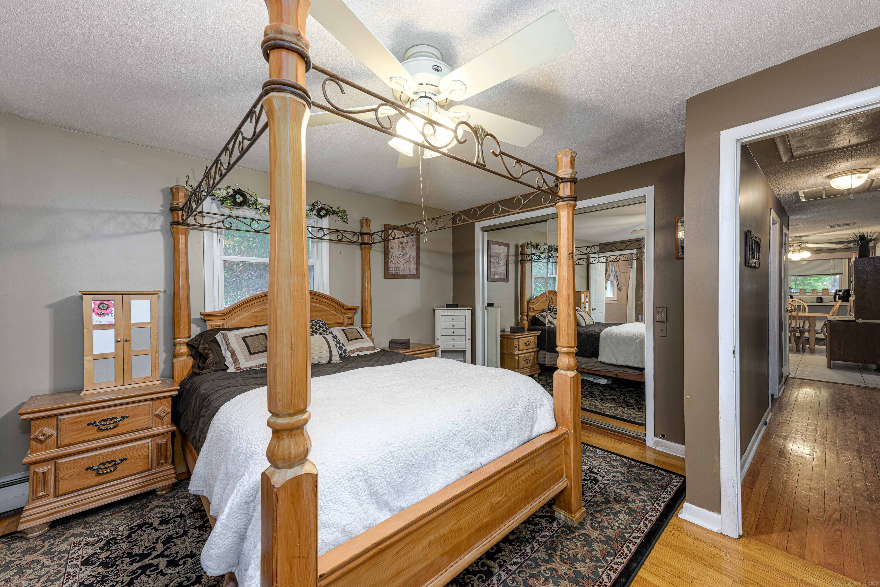 201 Rimmon Road North Haven, CT 06473 - Photo 16 of 40 a bedroom with bed and wooden floor